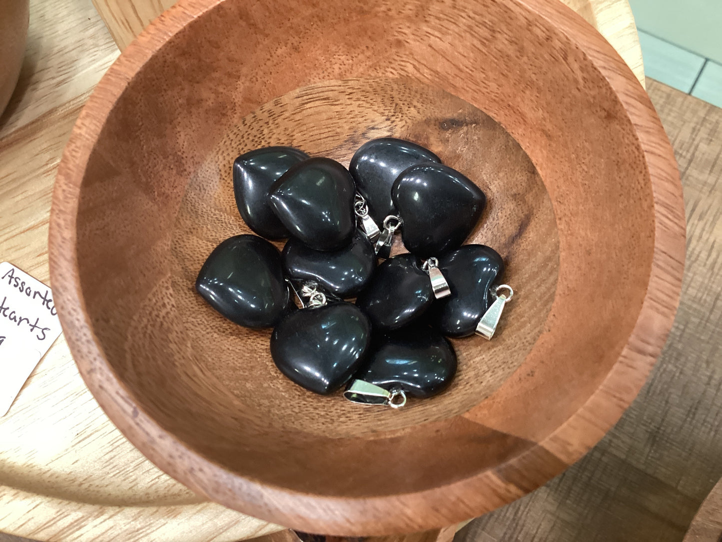 Heart-shaped black obsidian necklace charms with silver clasps.