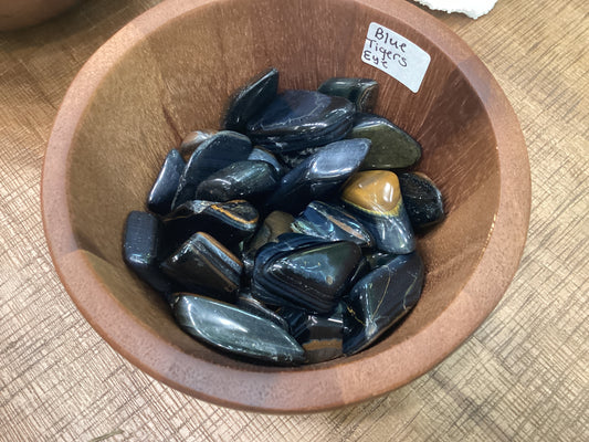 Assorted loose blue tiger's eye stones.