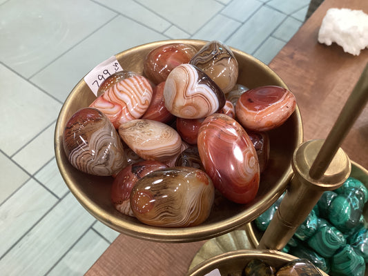 Assorted loose Madagascar silk agate stones.