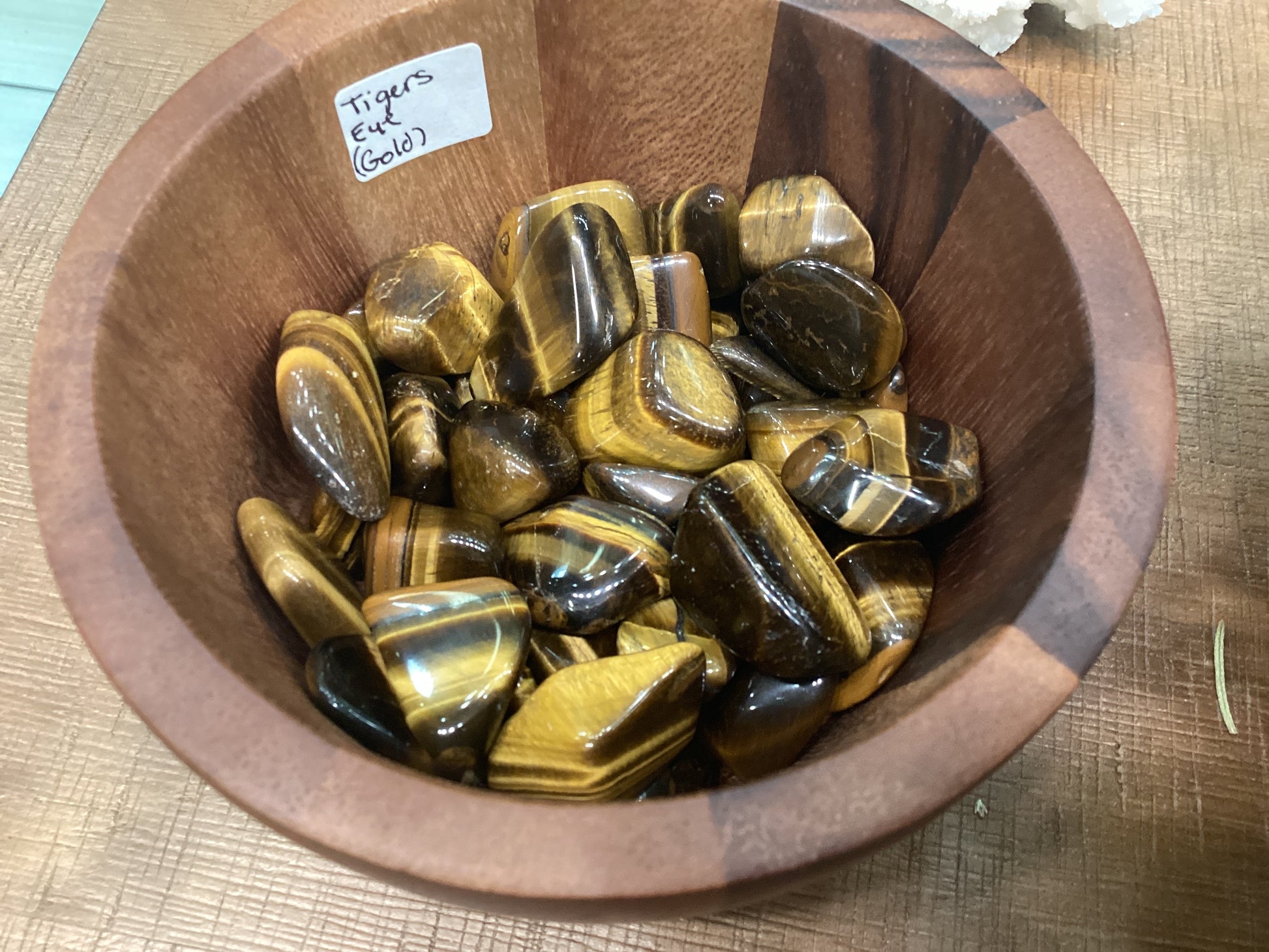 Assorted loose gold tiger's eye stones.