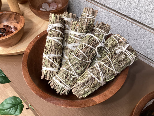 Bundles of dried rosemary tied with twine.