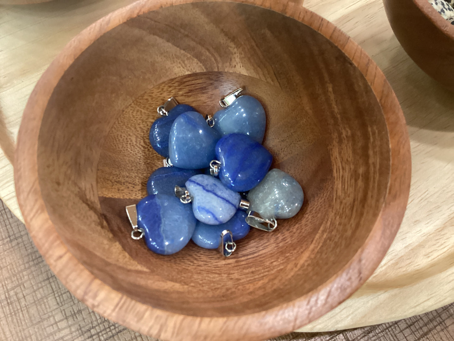 Heart-shaped blue angelite necklace charms with silver clasps.