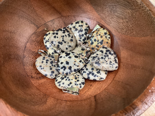 Heart-shaped dalmatian jasper necklace charms with silver clasps.